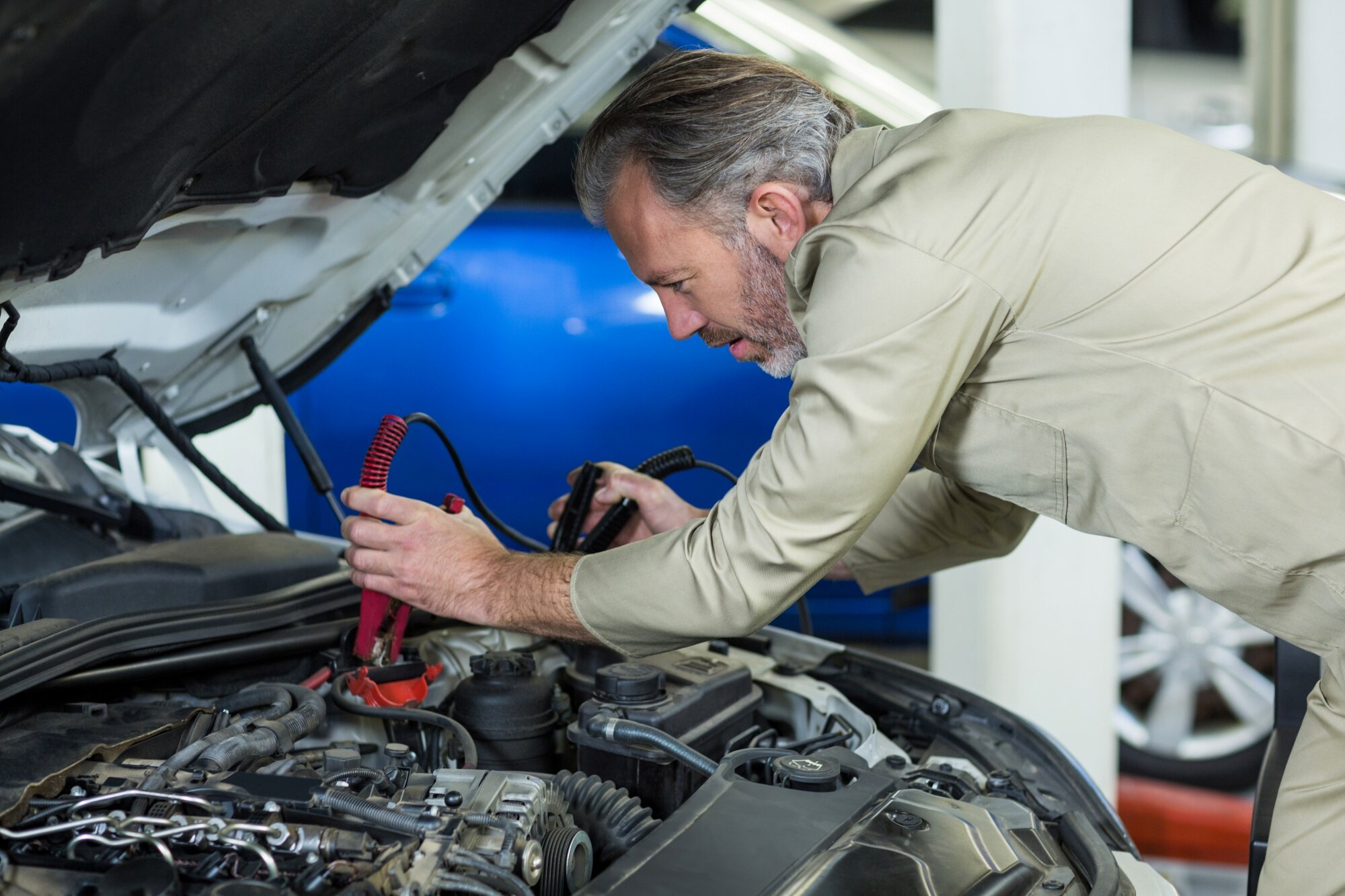 Mechanic Testing Car Battery