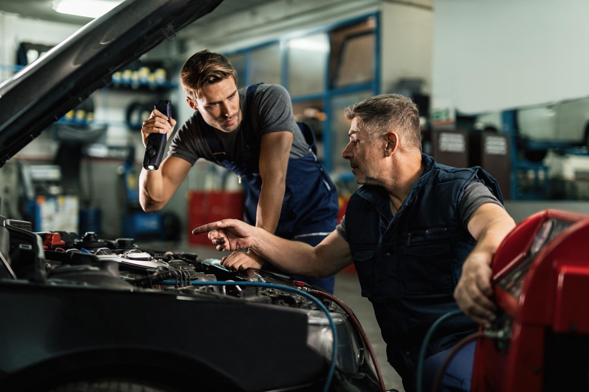 Two Mechanic Repairing Car AC